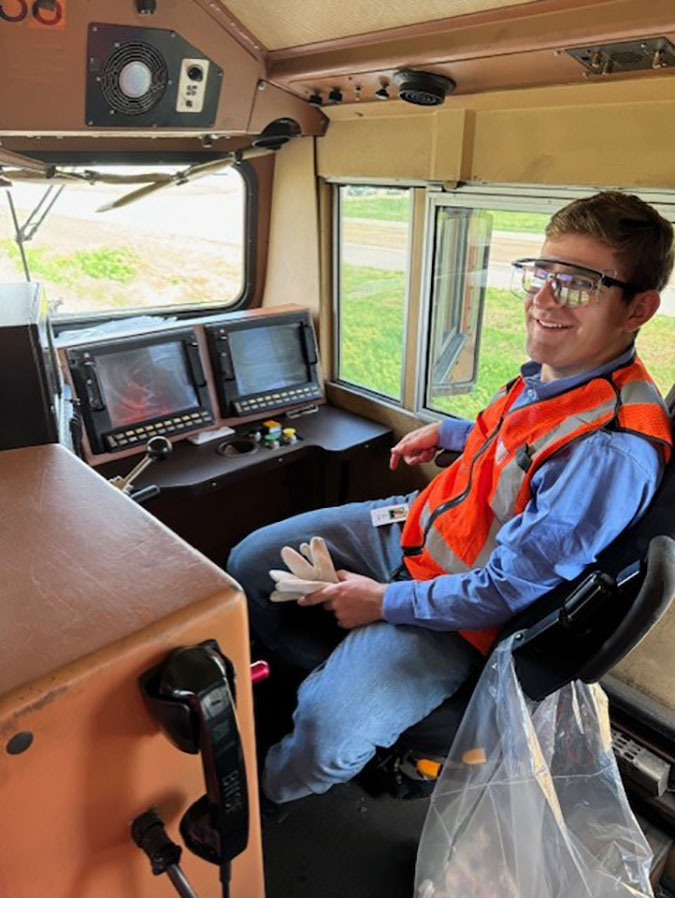 Luke Miller in the locomotive engineer’s seat Luke Miller in the locomotive engineer’s seat